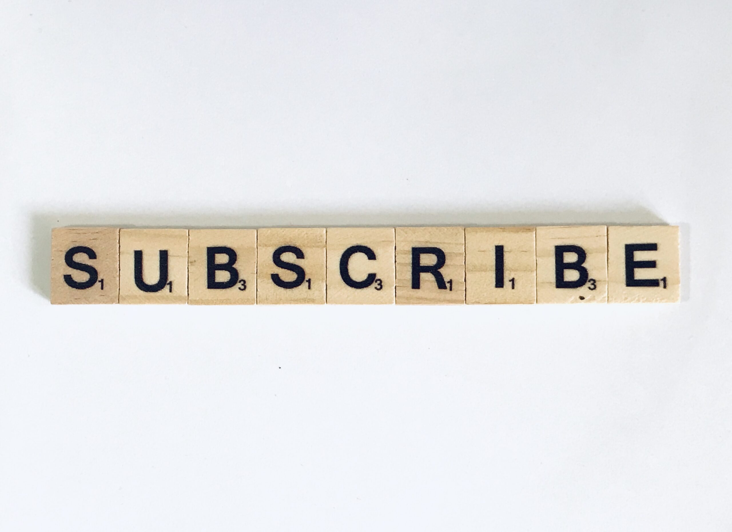 subscribe message made of wooden block letters 2026 09 22 15 45 43 utc scaled tronos